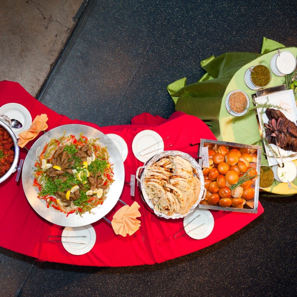 An IndAroma wedding buffet line, chafers set out with labelled Indian dishes.